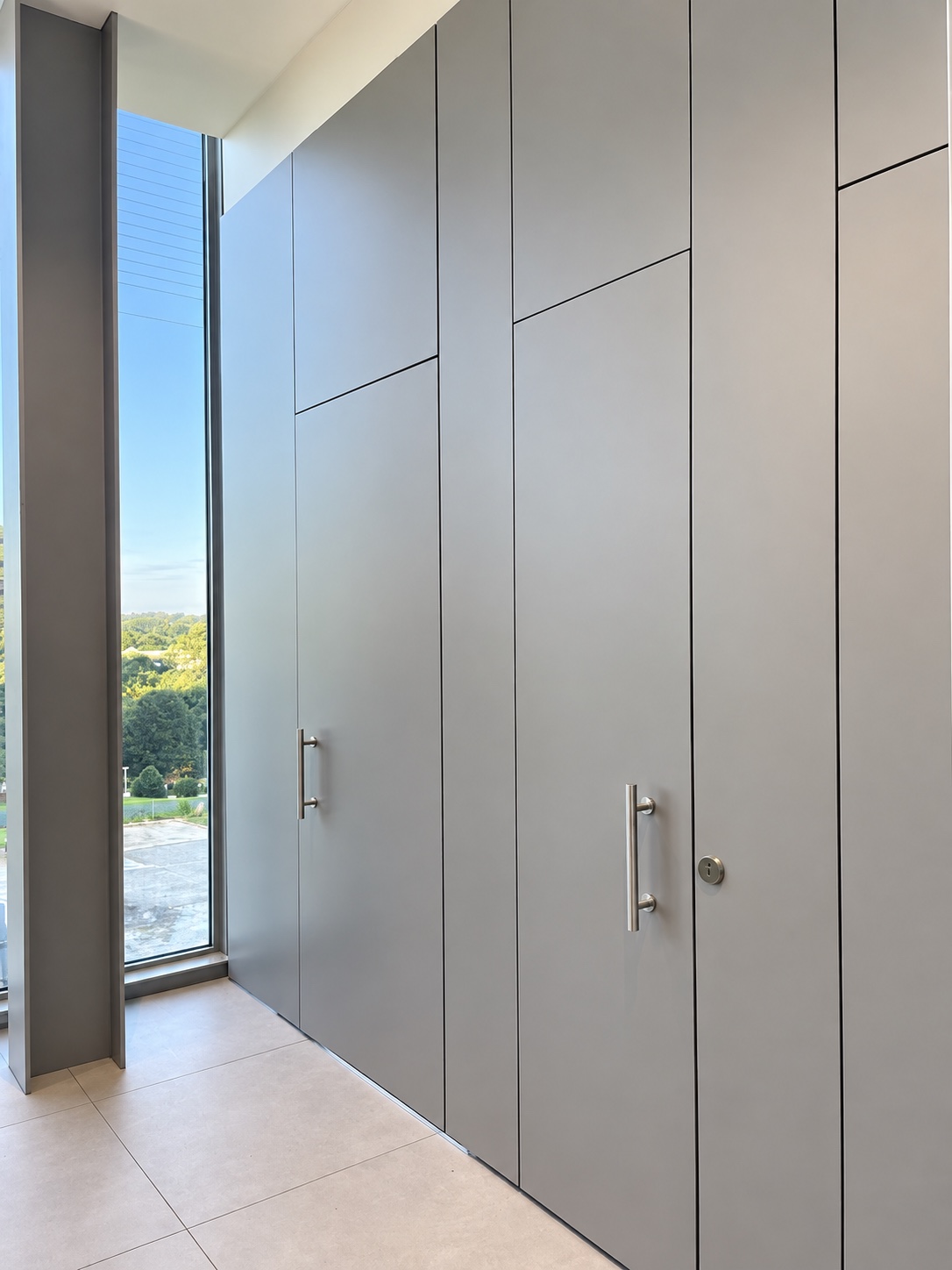 INFINITY full-height restroom partitions with integrated transoms