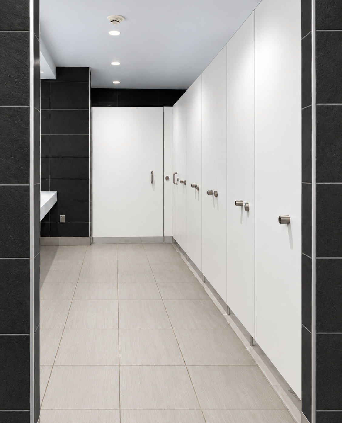 Restroom partition installation at John F. Kennedy Presidential Library and Museum